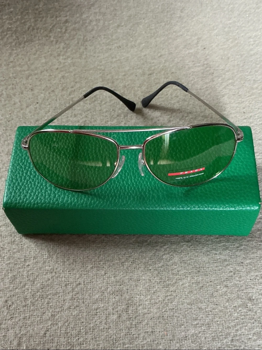 Prada Silver Frame Sunglasses with Green Lenses